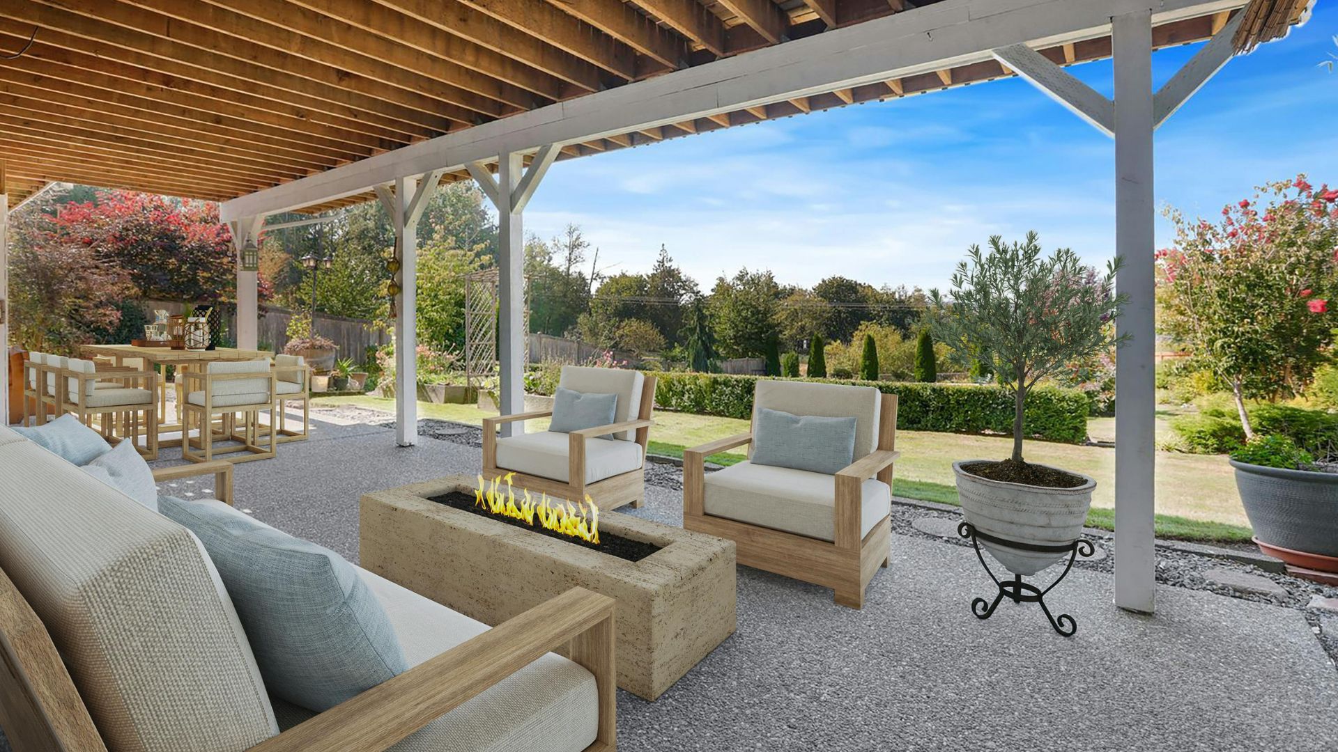 Outdoor patio with wooden furniture, fire pit, and landscaped garden view