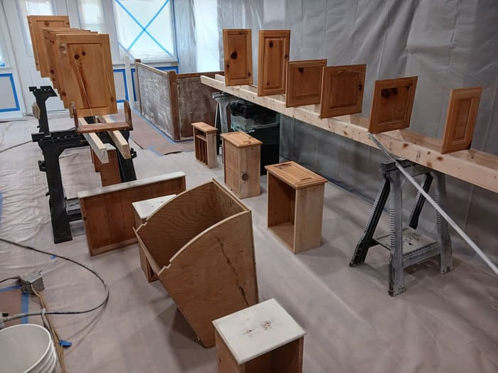 Wooden boxes and sawhorses in a workshop during construction or woodworking project